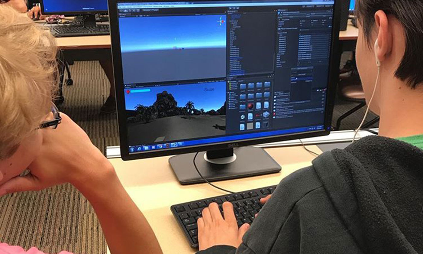 two students working on game