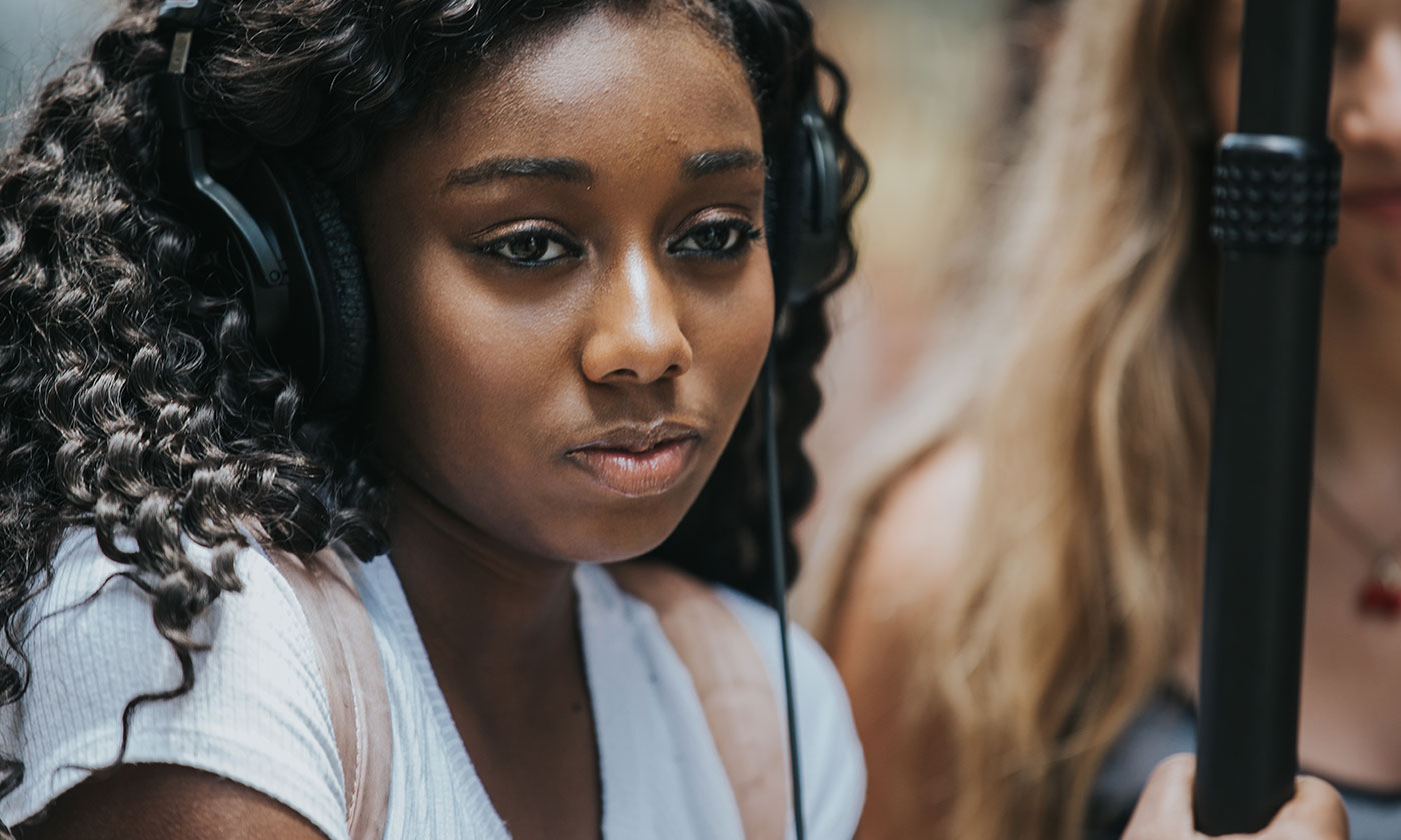 closeup of female student with camera equipment