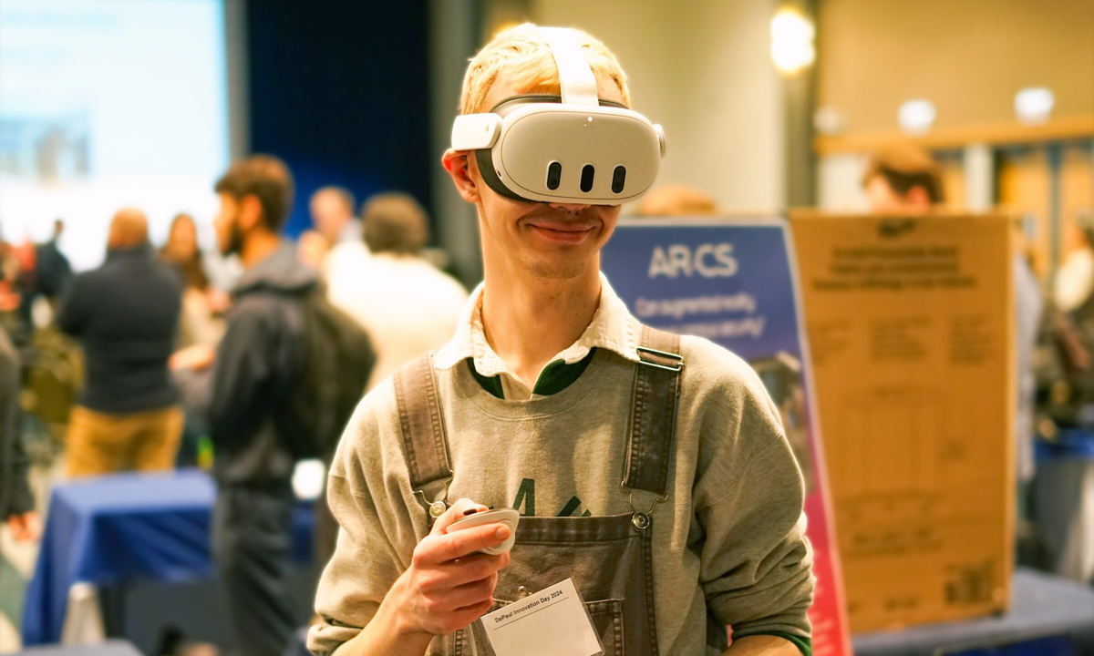 student using a XR headset and hand controllers