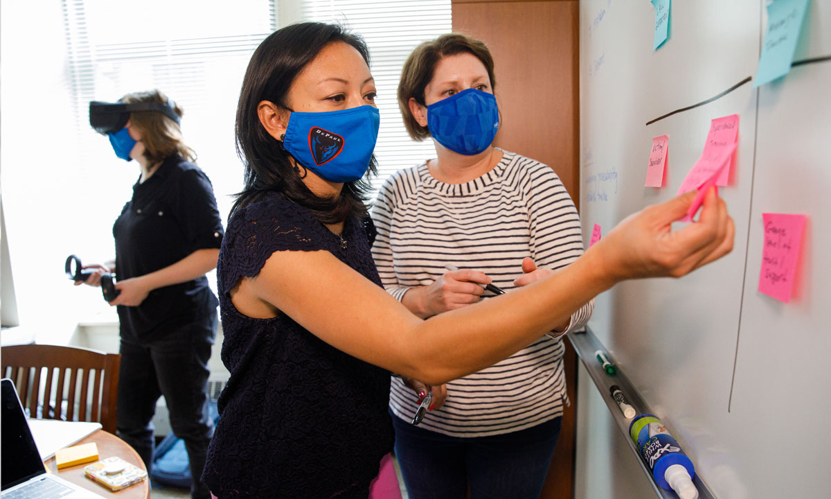 Students working on a whiteboard